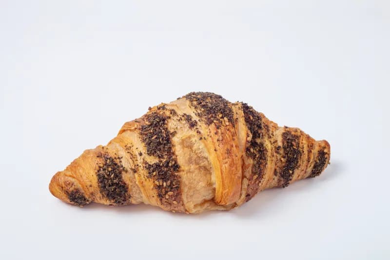 Za'atar Croissant — A perfect blend of French technique and Middle Eastern tradition. Our buttery, flaky croissant is generously filled with aromatic za'atar, a savory blend of wild thyme, toasted sesame, and tangy sumac. A Suhoor favorite.