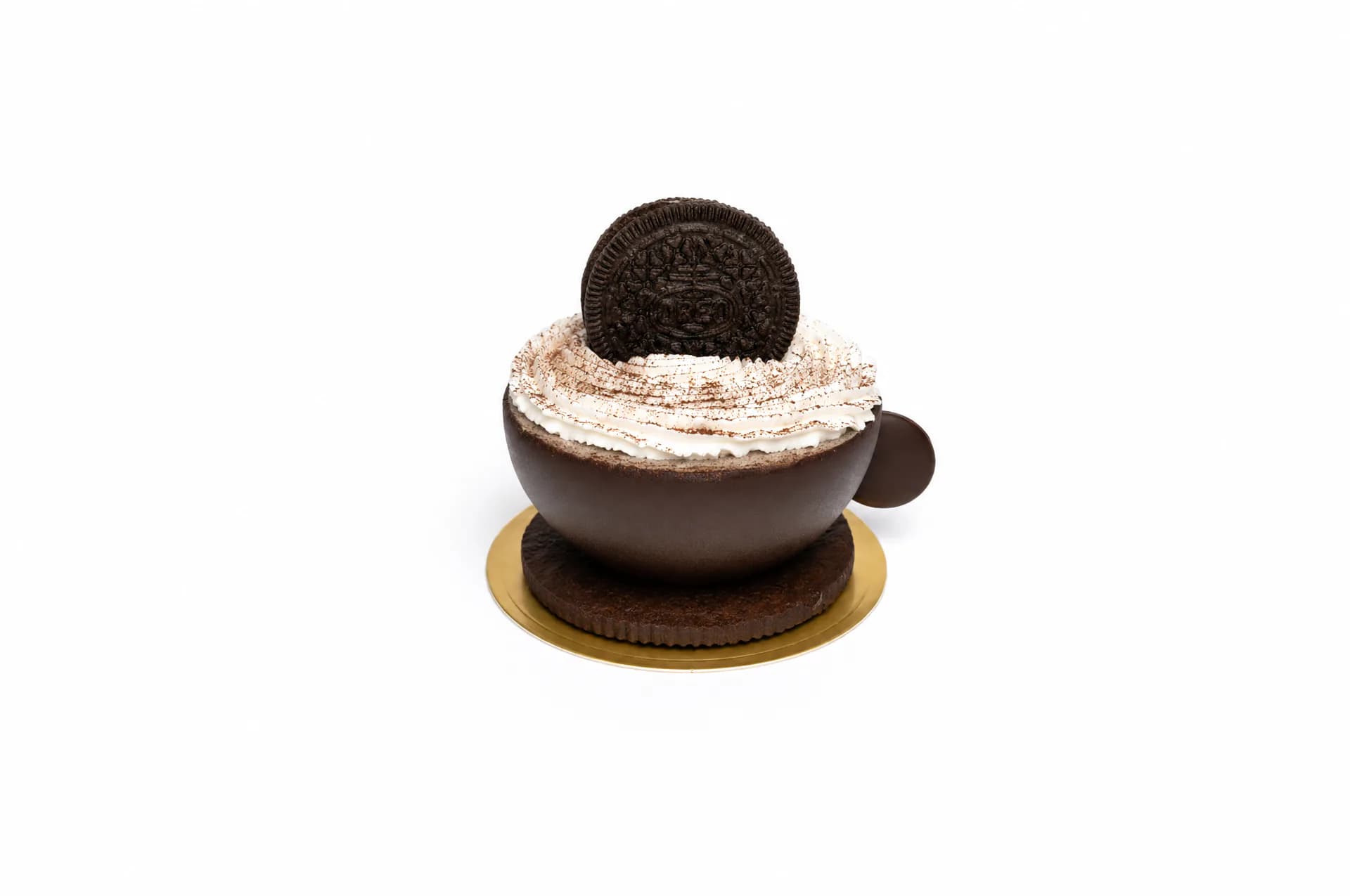 Oreo Cup — Glossy dark chocolate shell that cradles a luxurious vanilla cream infused with Oreo crumbles, crowned with a piped rosette and whole cookie. A sophisticated patisserie interpretation that marries crisp chocolate snap with textured filling.